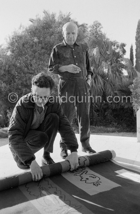 Pablo Picasso and Pierre Baudouin with tapestry "Les clowns à la lune bleue". La Californie, Cannes 1959. - Photo by Edward Quinn