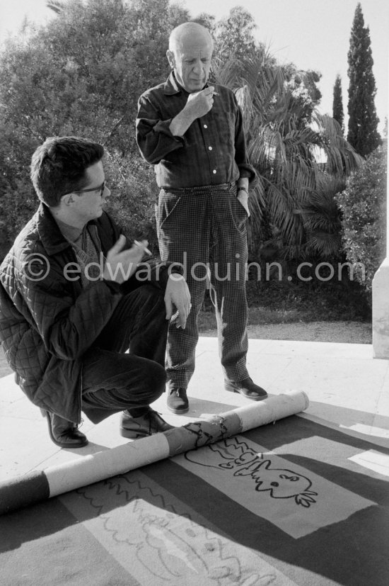 Pablo Picasso and Pierre Baudouin with tapestry "Les clowns à la lune bleue". La Californie, Cannes 1959. - Photo by Edward Quinn