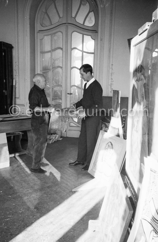 Pablo Picasso with a Spanish wicker mask of a bull, originally intended for bullfighters' training, takes a lesson in bull fighting from an expert, the matador Luis Miguel Dominguin. La Californie, Cannes 1959. - Photo by Edward Quinn