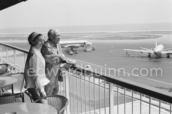 From a terrace at Nice Airport Pablo Picasso and Jacqueline watch for the arrival of the Leiris and the Lascaux from Paris. Nice Airport 1960. - Photo by Edward Quinn