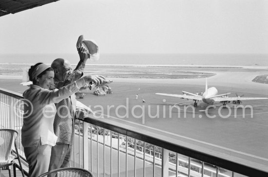 From a terrace at Nice Airport Pablo Picasso and Jacqueline watch for the arrival of the Leiris and the Lascaux from Paris. Nice Airport 1960. - Photo by Edward Quinn