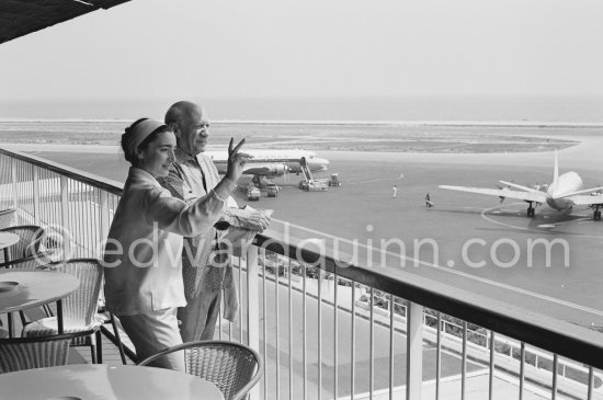 From a terrace at Nice Airport Pablo Picasso and Jacqueline watch for the arrival of the Leiris and the Lascaux from Paris. Nice Airport 1960. - Photo by Edward Quinn