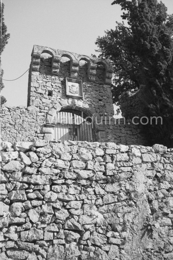 Château de Vauvenargues, where Pablo Picasso lived from 1959-62, in the foothills of Mont Sainte-Victoire, near Aix-en-Provence. A great square building dating from the sixteenth and eighteenth centuries. The Vauvenargues masonry coat of arms at the castle gate. As the family title traditionally goes to the owner of the p-roperty, when Pablo Picasso bought the castle he could claim to Marquis de Vauvenargues. Vauvenargues 1960. - Photo by Edward Quinn