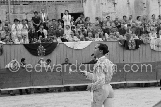 Luis Dominguin. On the grandstand Pablo Picasso (with hat), Jacqueline filming and Catherine Hutin, second row on the left Paulo Picasso.  Other photos in the bull ring of this bullfight see "Miscellaneous" - Photo by Edward Quinn