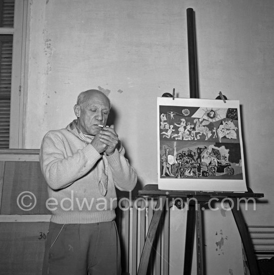 Pablo Picasso with small reproduction of War and Peace drawing on the vault of the Temple of Peace (Temple de la Paix, or Chapelle de la paix, Vallauris 1961. - Photo by Edward Quinn
