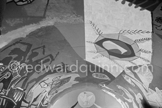War and Peace ("La Guerre et la Paix") drawing on the vault of the Temple of Peace (Temple de la Paix, or Chapelle de la paix). Pablo Picasso had added a semicircular panel with four interlocked figures holding a dove of peace, suggesting the unity of mankind. Vallauris 1961. - Photo by Edward Quinn