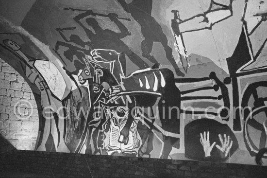 War and Peace ("La Guerre et la Paix") drawing on the vault of the Temple of Peace (Temple de la Paix, or Chapelle de la paix). A dove of peace, superimposed on the face of Françoise Gilot, on a shield of a young man. Vallauris 1961. - Photo by Edward Quinn