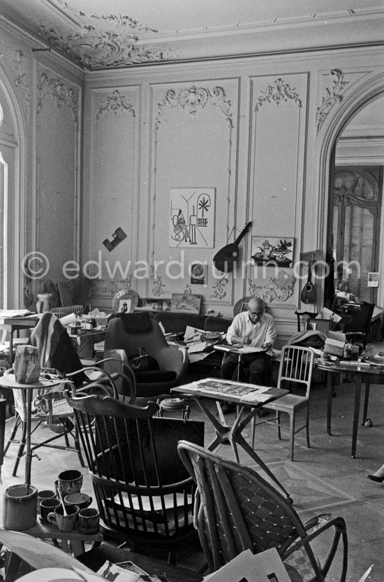 Pablo Picasso working on "Oeuf de pâques" with Caran d'ache wax oil pastels. In the forground a table by Joseph-Marius Tiola. La Californie, Cannes 1961. - Photo by Edward Quinn