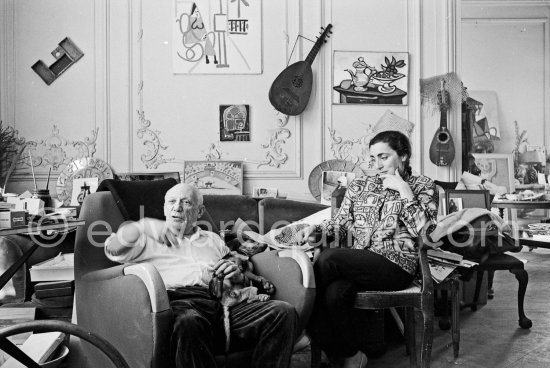 Pablo Picasso and Jacqueline (she is wearing a blouse made from a textile designed by Pablo Picasso) with dachshund Ma Jolie. La Californie, Cannes 1961. - Photo by Edward Quinn