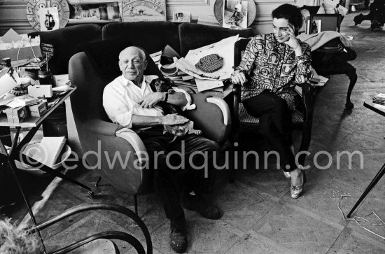 Picasso and Jacqueline (she is wearing a blouse made from a textile designed by Picasso) with dachshund Ma Jolie. . La Californie, Cannes 1961. - Photo by Edward Quinn