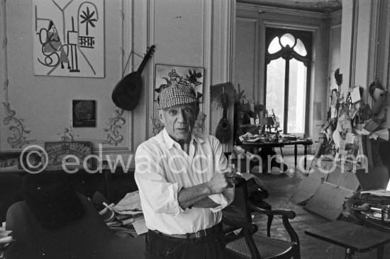 Pablo Picasso and Jacqueline. He never fails to surprise with the unusual, In this case a check dear-stalker worn with all the aplomb of a 19th century English Squire. La Californie, Cannes 1961.1 - Photo by Edward Quinn