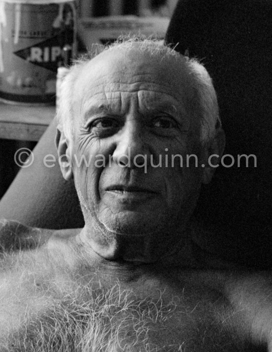Pablo Picasso with a Ripolin color can behind him. La Californie, Cannes 1961. - Photo by Edward Quinn
