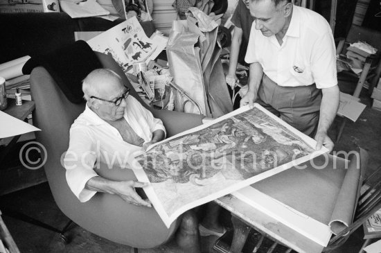 Pablo Picasso and Henri Matarasso, gallery owner and publisher, checking the etching "La Minotauromachie". La Californie, Cannes 1961. - Photo by Edward Quinn