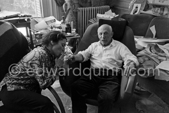 Easter time at La Californie. Pablo Picasso and Jacqueline enjoy a quiet Moment, Pablo Picasso holding Ma Jolie in his arms. Jacqueline is wearing a blouse made from a textile designed by Pablo Picasso. Pablo Picasso and Jacqueline Roque married in 1961. This photographs are taken a month later, the first pictures after their wedding. Cannes 1961. - Photo by Edward Quinn