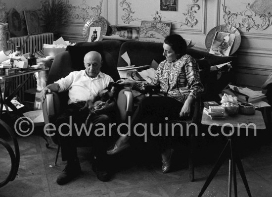 Easter time at Villa La Californie. Picasso and Jacqueline enjoy a quiet moment, Picasso holding his new puppy Ma Jolie in his arms. Jacqueline is wearing a blouse made from a textile designed by Picasso. Picasso and Jacqueline Roque married in 1961. This photograph is taken a month later, the first pictures by E.Q. after their wedding. La Californie, Cannes 1961. - Photo by Edward Quinn