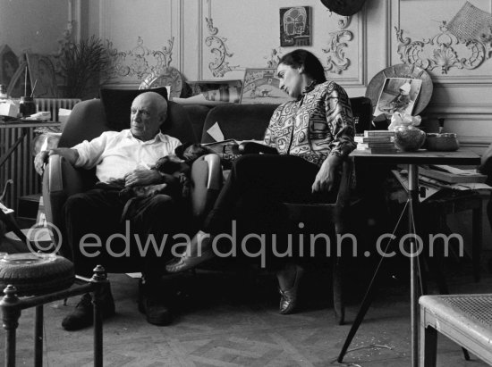Easter time at Villa La Californie. Pablo Picasso and Jacqueline enjoy a quiet moment, Pablo Picasso holding Ma Jolie in his arms. Jacqueline is wearing a blouse made from a textile designed by Pablo Picasso. Pablo Picasso and Jacqueline Roque married in 1961. These photographs are taken a month later, the first pictures by e.q. after their wedding. La Californie, Cannes 1961. - Photo by Edward Quinn