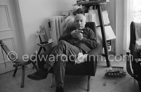 Pablo Picasso with a toy pistol (probably a lighter) he got as a present. Mas Notre-Dame-de-Vie, Mougins 1962. - Photo by Edward Quinn