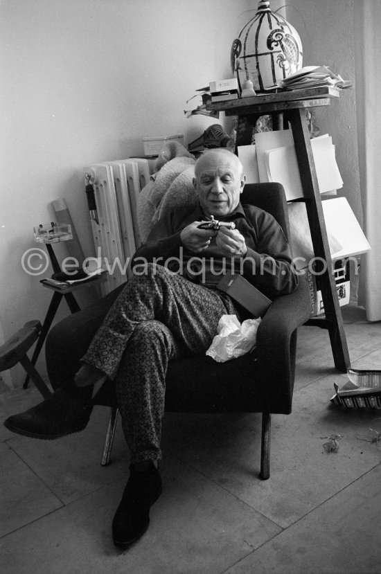 Pablo Picasso with a toy pistol (probably a lighter) he got as a present. Mas Notre-Dame-de-Vie, Mougins 1962. - Photo by Edward Quinn