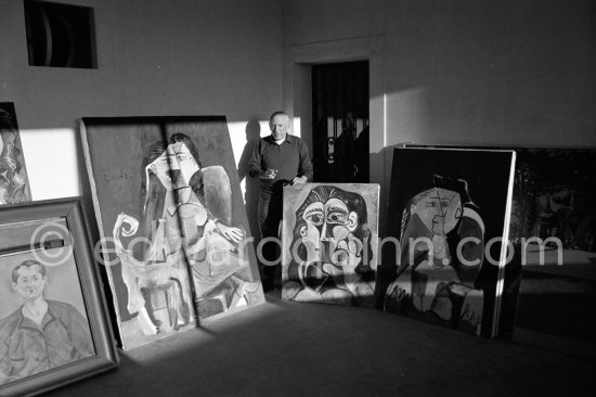 Pablo Picasso with his paintings and a work of his private collection by Joan Miró. Mas Notre-Dame-de-Vie, Mougins 1962. - Photo by Edward Quinn