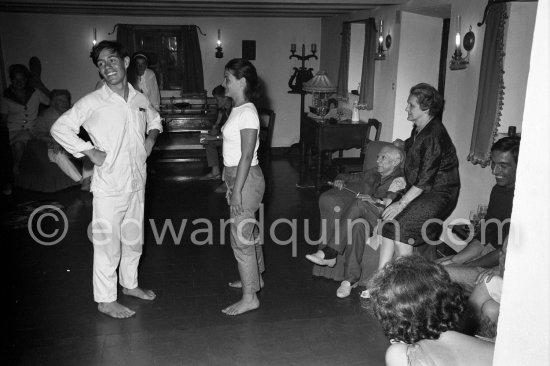 Louise Leiris and Pablo Picasso watching Paloma Picasso and Claude Picasso after dancing the Twist in a restaurant at Mougins 1962. - Photo by Edward Quinn