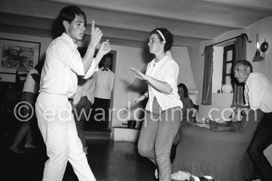 Picasso and andré Verdet watching Catherine ("Cathy") and Claude Picasso dancing the Twist in a restaurant at Mougins 1962. - Photo by Edward Quinn