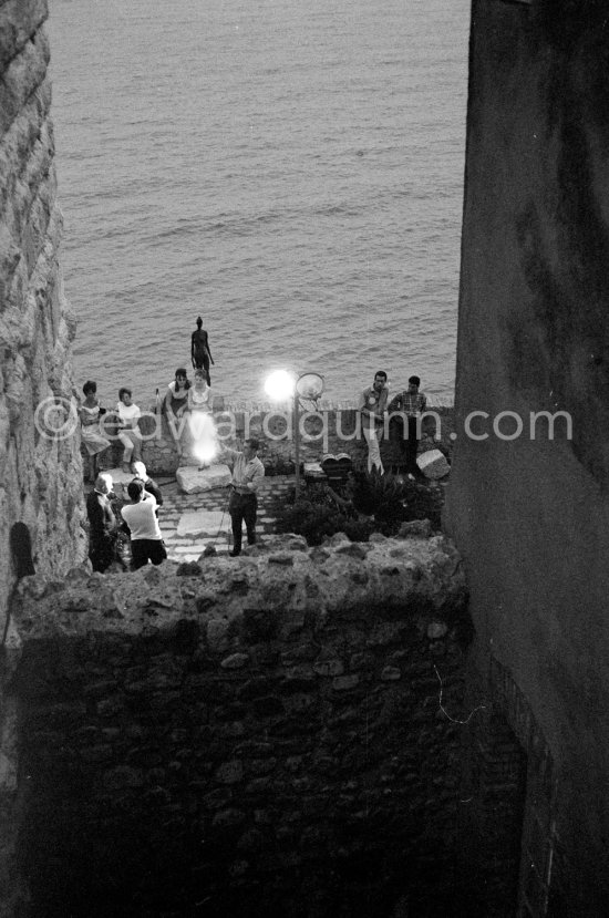 Jacques Prévert interviewed for a radio program. Opening of exhibition "Images de Jacques Prévert", Château Grimaldi, Antibes, 6.8.1963. - Photo by Edward Quinn