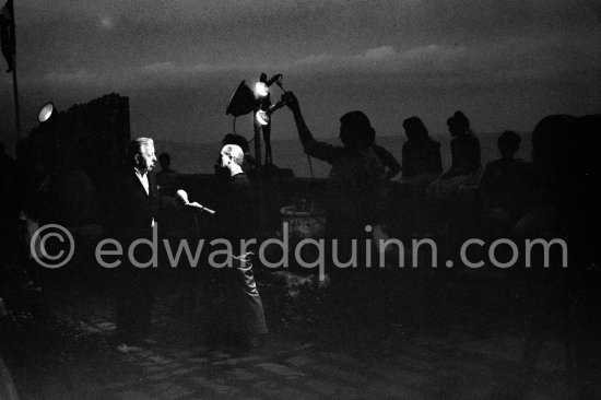 Jacques Prévert interviewed for a radio program. Opening of exhibition "Images de Jacques Prévert", Château Grimaldi, Antibes, 6.8.1963. - Photo by Edward Quinn