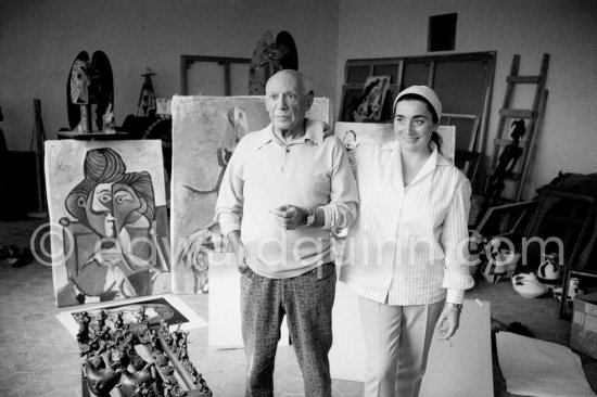 Pablo Picasso and Jacqueline in the room that became known as the viewing room. He would arrange his work so that he could see it from the living room every time he passed. He liked to bring his close friends there for a private viewing. Mas Notre-Dame-de-Vie, Mougins 1964. - Photo by Edward Quinn