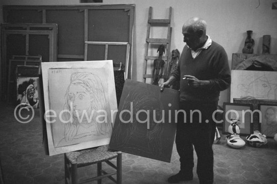 In his studio at Mas Notre-Dame-de-Vie, Pablo Picasso shows for comparison his original linoleum block for "Portrait of Jacqueline" and a linocut print made from it. Mas Notre-Dame-de-Vie, Mougins 1964. - Photo by Edward Quinn