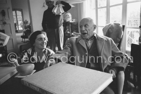 Jacqueline holding Pablo Picasso's hand. One of the first photos after his surgery at the British-American Hospital in Paris. Notre-Dame-De-Vie, Mougins 1965. - Photo by Edward Quinn