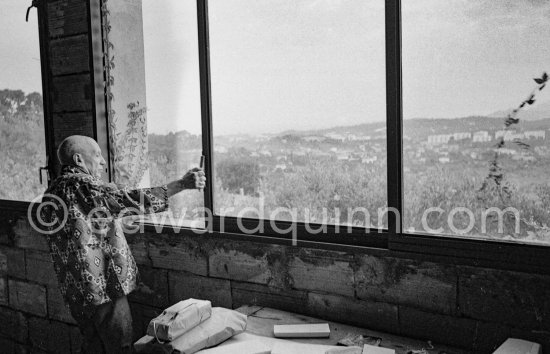 Pablo Picasso on a window of one of the studios he added to Mas Notre-Dame-de-Vie, Mougins 1967 - Photo by Edward Quinn