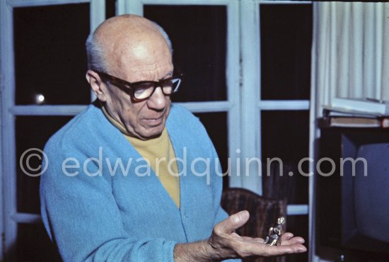 Pablo Picasso holding a small erotic bronze, Priapus, inspired by some primitive sculptures that had always interested and intrigued him. Mas Notre-Dame-de-Vie, Mougins 1969. - Photo by Edward Quinn