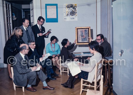 Lolita Vilató farleft, Pablín Vilató with red pencil, and people of the Museu Pablo Picasso Barcelona (?). Pablo Picasso gave the collection his family held in Barcelona (among others the Vilató family, his nephews) to the Museu Pablo Picasso Barcelona. The collection is made up of oil paintings and drawings from his childhood and youth era. Barcelona 1970. - Photo by Edward Quinn