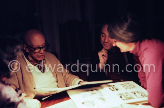 Pablo Picasso, Jacqueline, Bill Rubin and Mila Gagarine viewing the layout of the newest "Le Zervos", the catalogue raisonné of the works of Pablo Picasso. Visit of Mila Gagarine (Cahiers d'art) and William (Bill) Rubin, MoMA. One of the last photos of Pablo Picasso by Edward Quinn. Viewing Mas Notre-Dame-de-Vie, Mougins 7. Jan 1972. - Photo by Edward Quinn