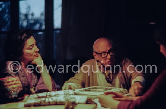 Pablo Picasso, Jacqueline and Mila Gagarine viewing the layout of the newest "Le Zervos", the catalogue raisonné of the works of Pablo Picasso. Visit of Mila Gagarine (Cahiers d'art) and William (Bill) Rubin, MoMA. One of the last photos of Pablo Picasso by Edward Quinn. Mas Notre-Dame-de-Vie, Mougins 7. Jan 1972. - Photo by Edward Quinn
