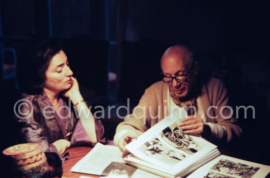 Pablo Picasso and Jacqueline viewing the layout of the newest "Le Zervos", the catalogue raisonné of the works of Pablo Picasso. One of the last photos of Pablo Picasso by Edward Quinn. Mas Notre-Dame-de-Vie, Mougins 7. Jan 1972. - Photo by Edward Quinn