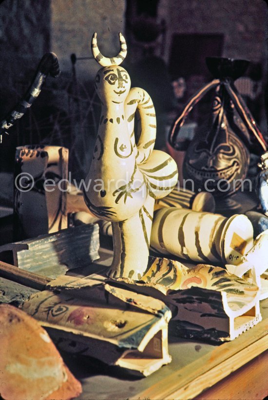 In front of a ceramic figure, some broken tiles painted and treated like ceramics. Ground floor, Mas Notre-Dame-de-Vie, Mougins 1974. (photographed after Pablo Picasso's death) - Photo by Edward Quinn