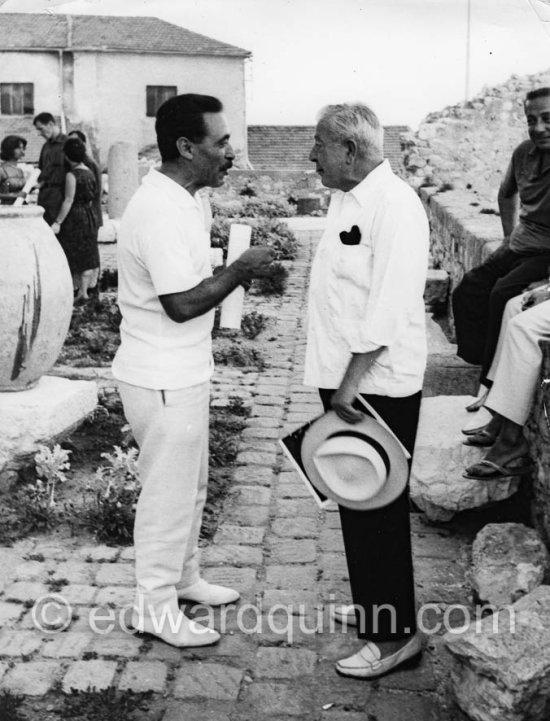 Jacques Prévert and Michele Sapone, Picasso's tailor. Exhibition of Mario Prassinos. Musée Grimaldi, Antibes 1961. - Photo by Edward Quinn