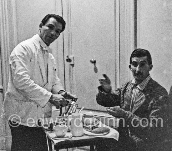 Edward Quinn and a photographer friend waiting in Carlton Hotel right outside the door of Kim Novak's room. Cannes 1956. - Photo by Edward Quinn