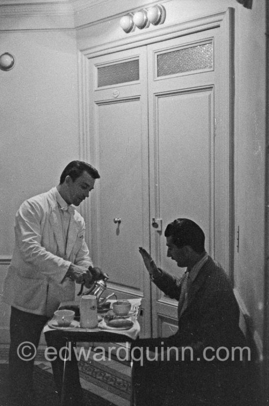 Edward Quinn and a photographer friend waiting in Carlton Hotel right outside the door of Kim Novak's room. Cannes 1956. - Photo by Edward Quinn