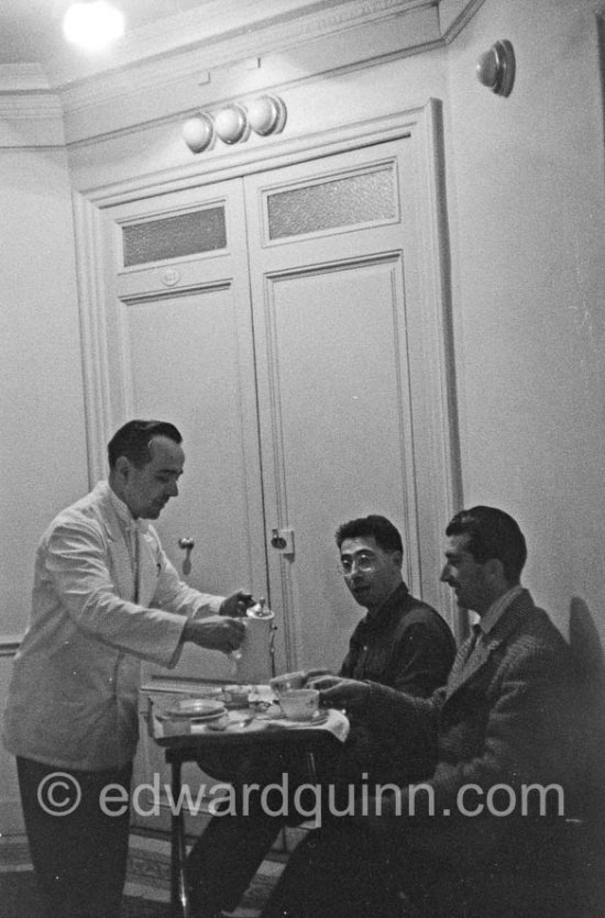 Edward Quinn and another photographer waiting in front of the door to the room of Kim Novak at Carlton Hotel. Cannes 1956. - Photo by Edward Quinn