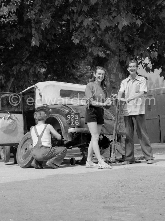 Edward and Gret Quinn in good mood after waiting two days for a mechanic who was able to repair their Mathis 1931/32 Type PYC in a village near Arles. Summer 1951. - Photo by Edward Quinn