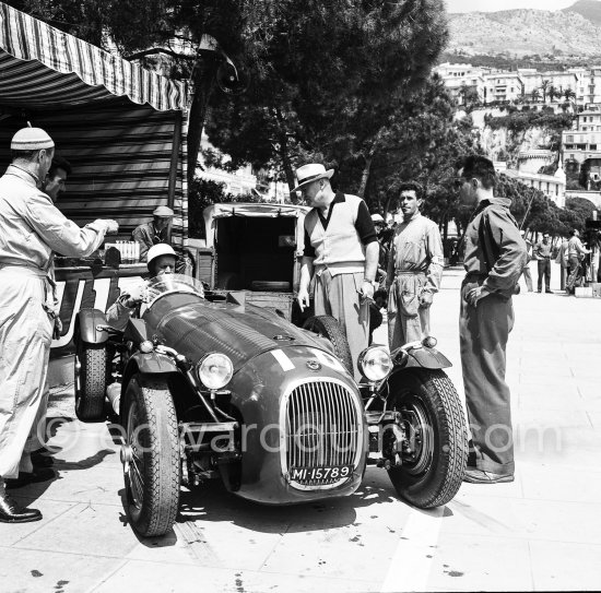 During filming of "The Racers": Louis Chiron, John Fitch who did the driving stunts for Kirk Douglas in the HWM Alta, director Henry Hathaway (with hat). The car, ex-Stirling Moss, which was later turned into the Stovebolt Special after MGM sold the cars off when filming finished. Owner Simon Taylor. Monaco 1954. - Photo by Edward Quinn