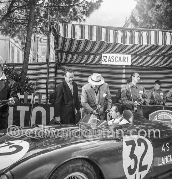 Alberto Ascari in Lancia D24 Spider Sport during filming of "The Racers" in Lancia D24. Director Henry Hathaway (with hat), behind him actor Gilbert Roland. Monaco 1954. - Photo by Edward Quinn