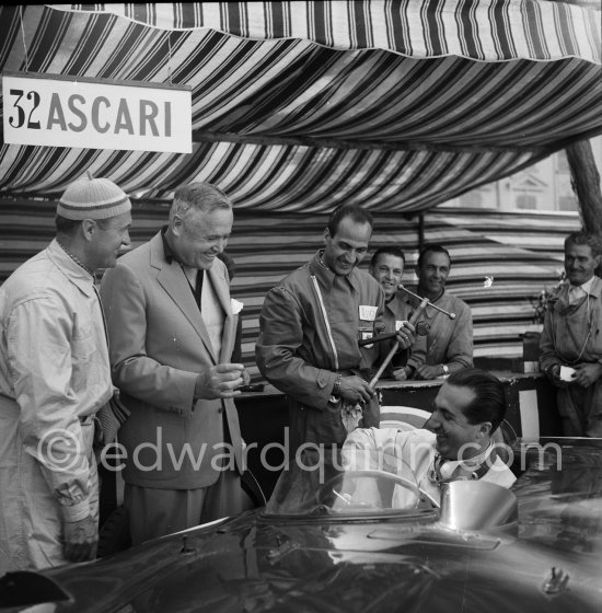 Alberto Ascari in Lancia D24 in the film "The Racers". Director Henry Hathaway (with hat), Louis Chiron, Alberto Ascari in Lancia D24 for the film "The Racers". Monaco 1955. - Photo by Edward Quinn
