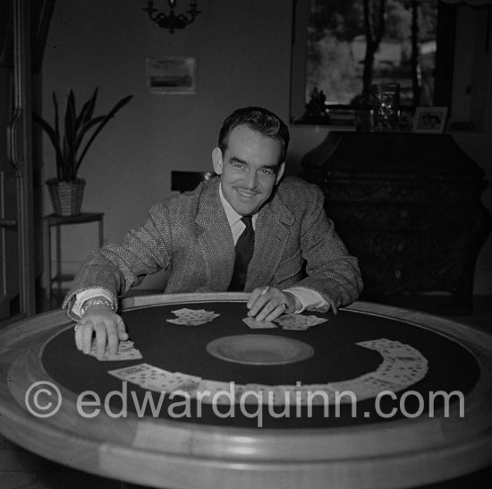 Prince Rainier of Monaco playing cards at Villa Iberia, Saint-Jean-Cap-Ferrat 1954. - Photo by Edward Quinn