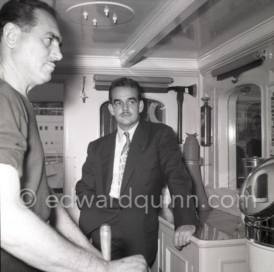 Prince Rainier on board his yacht Deo Juvante II anchored at Monaco harbor, Nov. 1953. - Photo by Edward Quinn