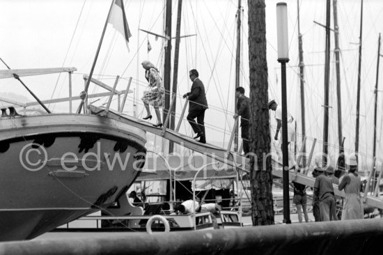 Princess Grace and Prince Rainier on board cargo ship Costa del Sol, which replaced yacht Deo Juvante II, later converted for Prince Rainier into luxury boat Deo Juvante III. Anchored in Monaco harbor 1959. - Photo by Edward Quinn