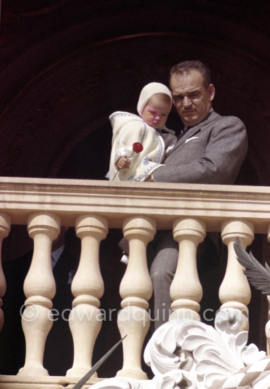 Prince Rainier of Monaco with Princess Caroline at the Palace window, on the day of the Baptism of Prince Albert, in Monaco-Ville, 20th April, 1958. - Photo by Edward Quinn