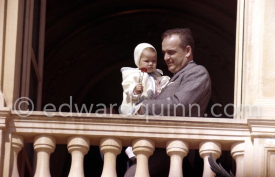 Prince Rainier of Monaco with Princess Caroline at the Palace window, on the day of the Baptism of Prince Albert, in Monaco-Ville, 20th April, 1958. - Photo by Edward Quinn